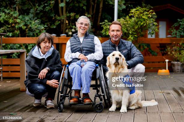 Founder Tatjana Kreidler, Frieda Krieger and her dog Ayden and TV host Jochen Bendel during the Purina appeal campaign for VITA Assistenzhunde on...