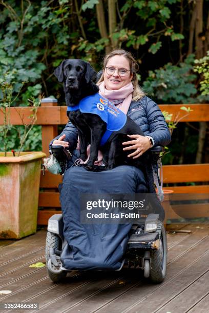 Nina Hoffmann and her dog Hazel during the Purina appeal campaign for VITA Assistenzhunde on September 28, 2021 in Huemmerich near Bonn, Germany.