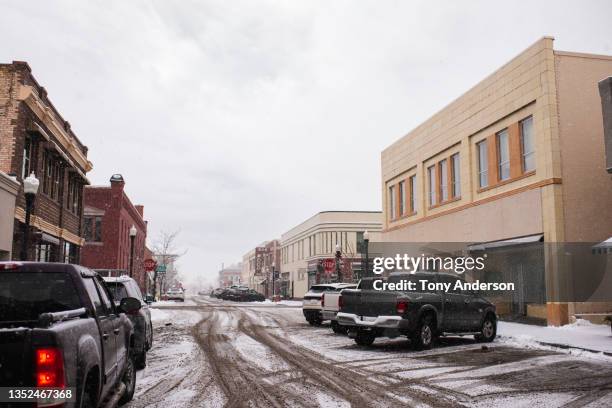 small town street in snow fall - idaho falls stock pictures, royalty-free photos & images