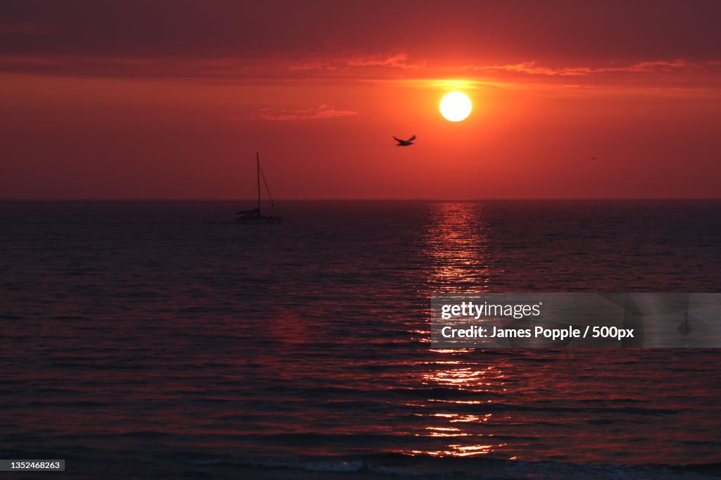 Scenic view of sea against orange sky,S Esplanade,Glenelg South,South Australia,Australia