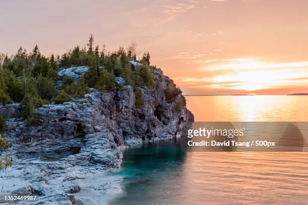 scenic view of sea against sky during sunset,bruce peninsula national park,canada - ontario canada landscape stock pictures, royalty-free photos & images