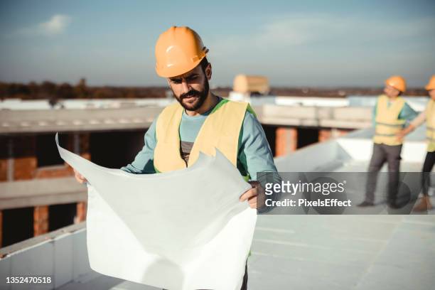 making sure everything is in place - roof inspector stock pictures, royalty-free photos & images