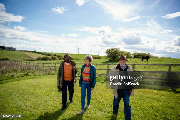 enjoying the countryside together - rural community stock pictures, royalty-free photos & images
