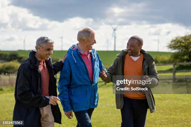 senior males walking together - only senior men stock pictures, royalty-free photos & images