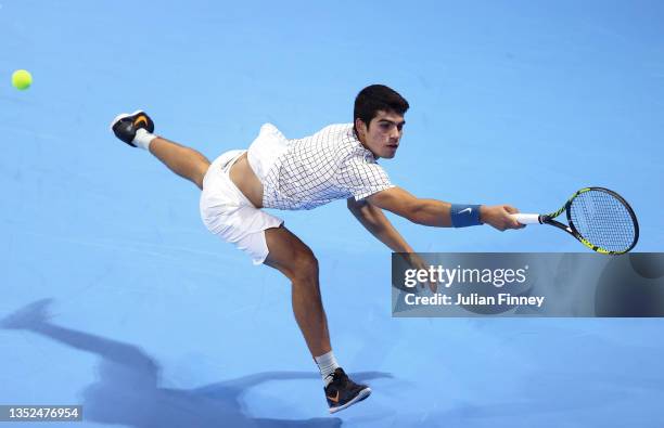 Carlos Alcaraz of Spain stretches for a backhand in his group round robin match against Brandon Nakashima of USA during Day Two of the Next Gen ATP...