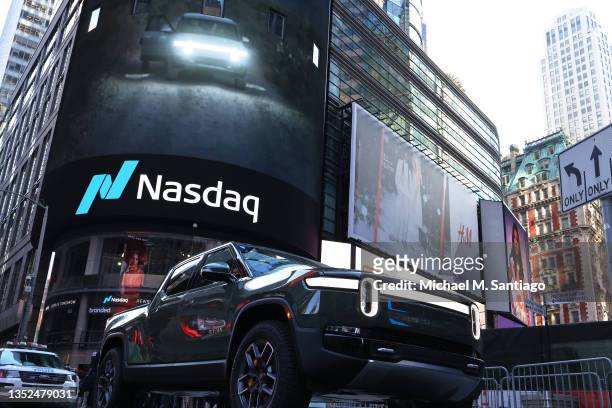 Rivian electric truck is displayed near the Nasdaq MarketSite building in Times Square on November 10, 2021 in New York City. Rivian, an electric...
