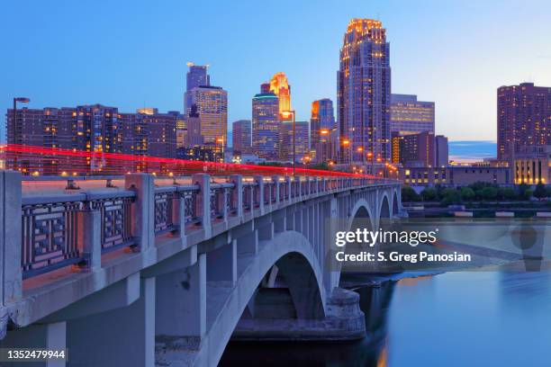 minneapolis skyline + central avenue bridge - minneapolis downtown stock pictures, royalty-free photos & images