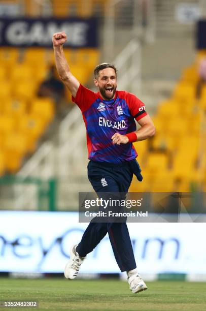 Chris Woakes of England celebrates the wicket of Kane Williamson of New Zealand during the ICC Men's T20 World Cup semi-final match between England...