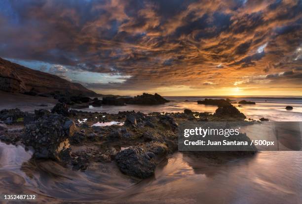 scenic view of sea against sky during sunset,playa de la solapa,spain - solapa - fotografias e filmes do acervo