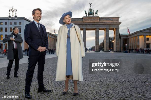 Crown Prince Frederik of Denmark and Queen Margrethe II of Denmark visit the Brandenburg Gate on November 10, 2021 in Berlin, Germany. The Danish...