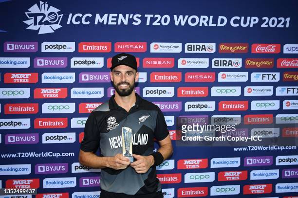 Daryl Mitchell of New Zealand poses after being named Player of the Match following the ICC Men's T20 World Cup semi-final match between England and...