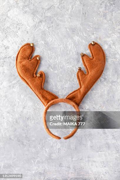 christmas reindeer antler headband on gray background. christmas day concept. - antler stock pictures, royalty-free photos & images