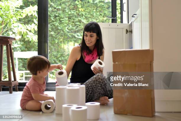 woman keeping merchandise on the shelf - baby products stock pictures, royalty-free photos & images