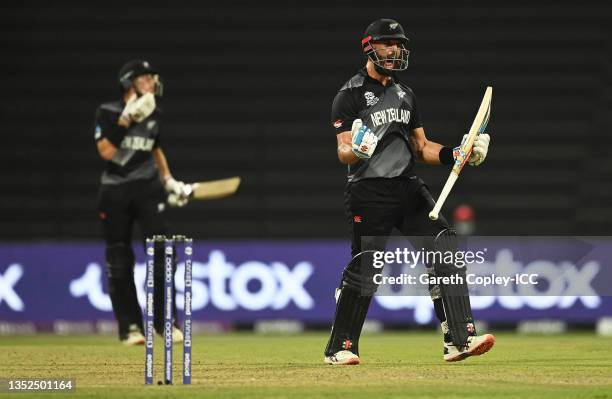 Daryl Mitchell of New Zealand celebrates following the ICC Men's T20 World Cup semi-final match between England and New Zealand at Sheikh Zayed...