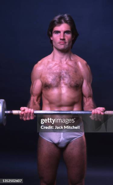 Portrait of fitness model Rick Foster as he lifts a barbell, New York, New York, October 1978. The photo was taken for After Dark magazine.