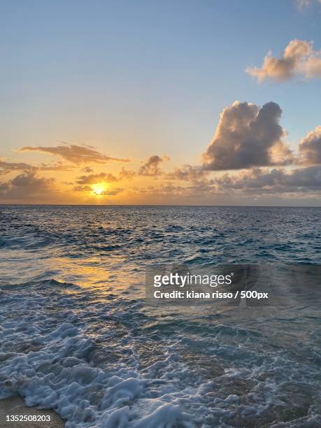 scenic view of sea against sky during sunset - kiana kim stockfoto's en -beelden