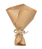 Empty craft paper wrapping cornet tied with beige canvas ribbon isolated