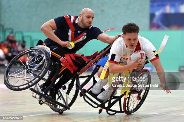Jeremy Bourson of France tackles Tom Halliwell of England during the International Wheelchair Rugby League Test Series between England and France at...