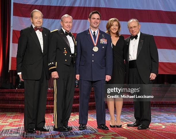 Oliver Mendell, Martin E. Dempsey, Airman of the year Michael Brait, Chris Jansing and Myron Berman pose onstage at the 50th USO Armed Forces gala &...