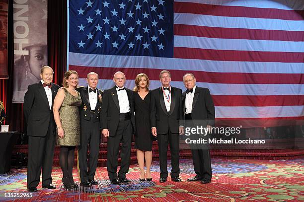 Oliver Mendell, Patricia Parry, Martin E. Dempsey, Mike Parry, Chris Jansing, Scott Bill and Myron Berman pose onstage as the award for Sailor of the...