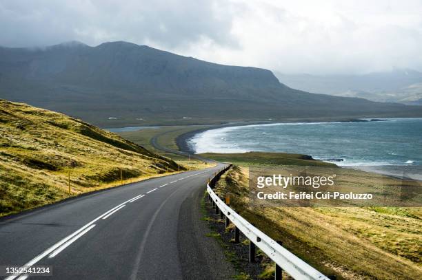 winding and coastal road at grundarfjörður - snaefellsnes stock pictures, royalty-free photos & images
