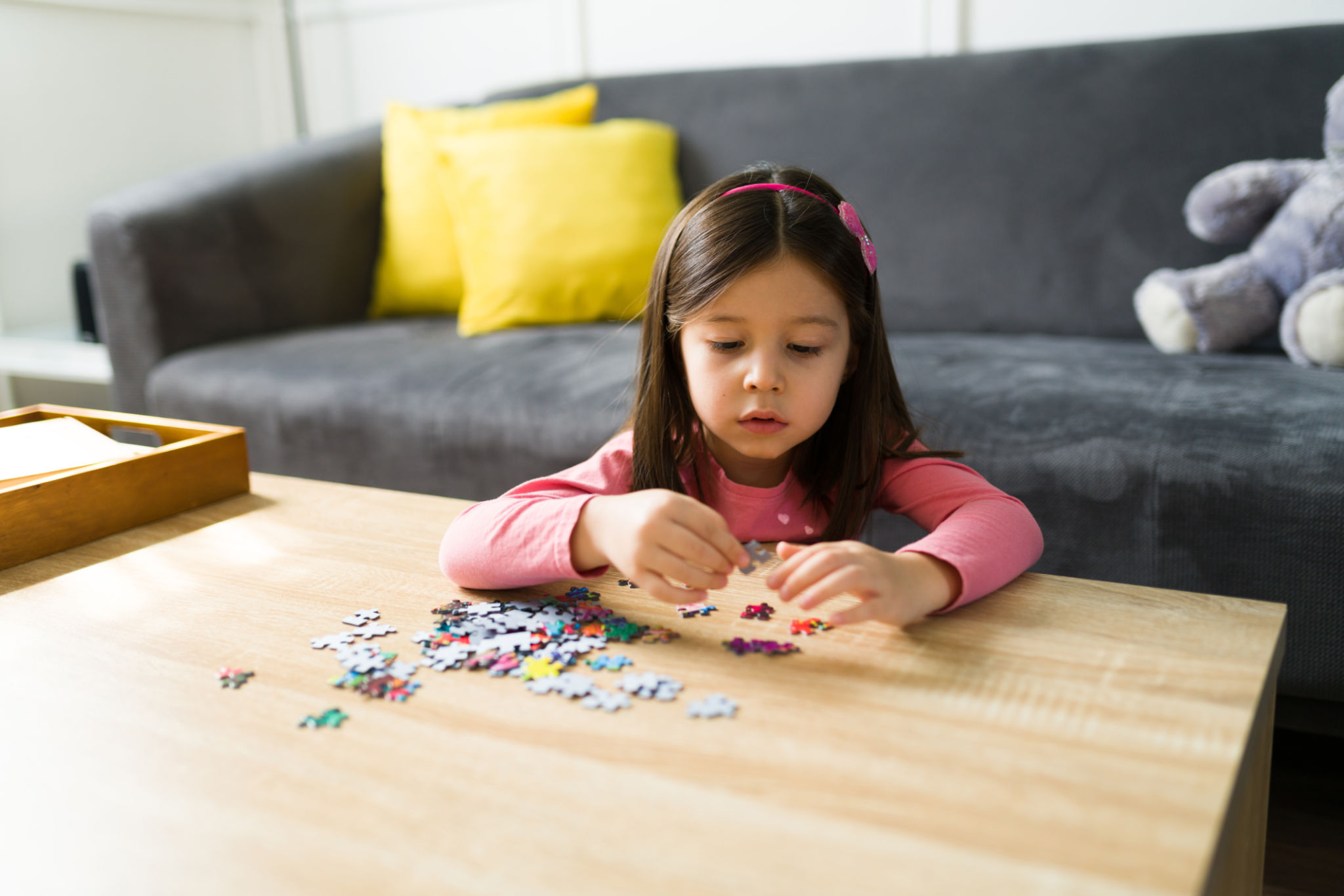child playing puzzle