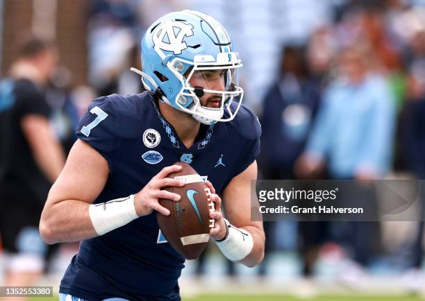 Sam Howell of the North Carolina Tar Heels warms up during their game against the Wake Forest Demon Deacons at Kenan Memorial Stadium on November 06,...