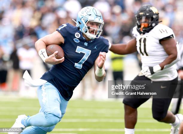Sam Howell of the North Carolina Tar Heels runs against the Wake Forest Demon Deacons during their game at Kenan Memorial Stadium on November 06,...