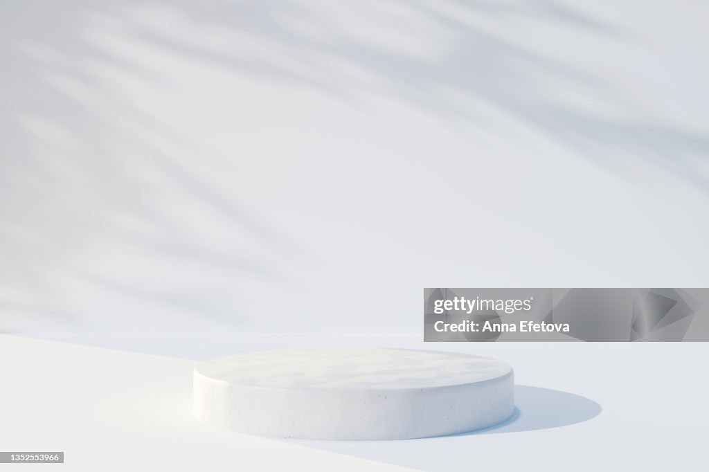 Cylindrical white ceramic podium on white background with many plant shadows. Perfect platform for showing your products. Three dimensional illustration