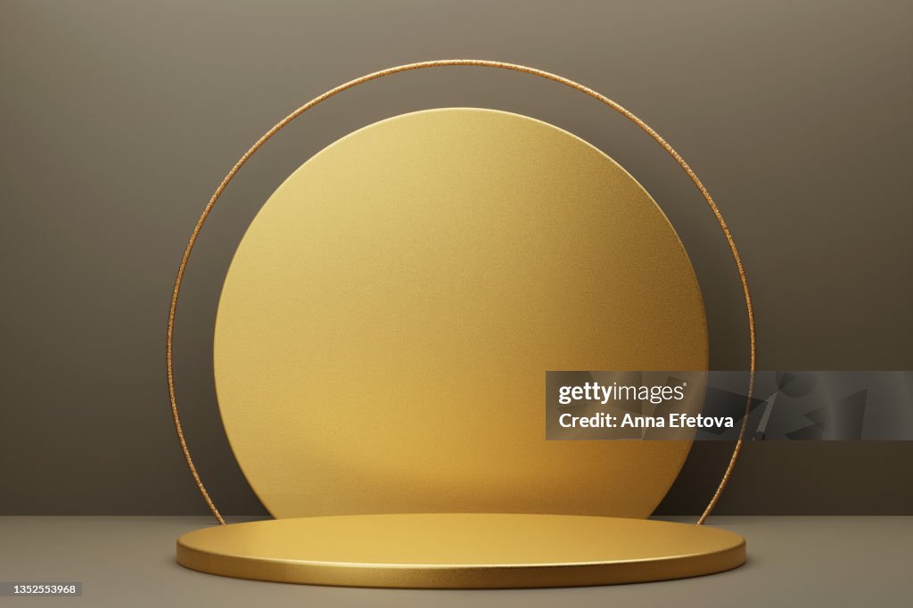 Round gold metal podium on gray background with gold circle and thin round gold border on top. Perfect platform for showing your products. Three dimensional illustration