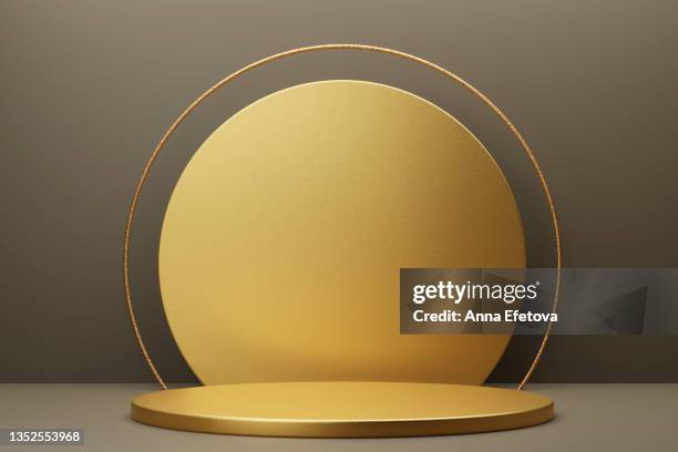 round gold metal podium on gray background with gold circle and thin round gold border on top. perfect platform for showing your products. three dimensional illustration - etapa desportiva imagens e fotografias de stock