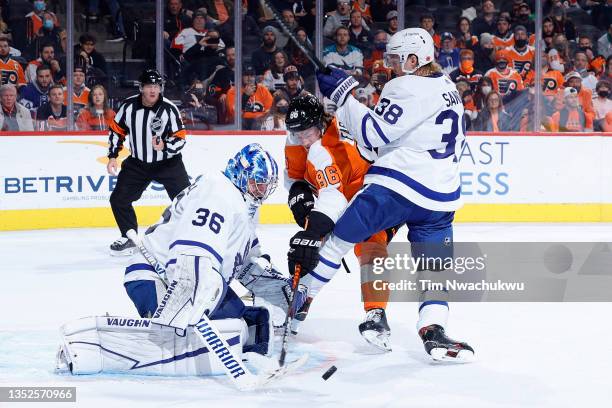 Jack Campbell and Rasmus Sandin of the Toronto Maple Leafs block a shot by Joel Farabee of the Philadelphia Flyers during the second period at Wells...