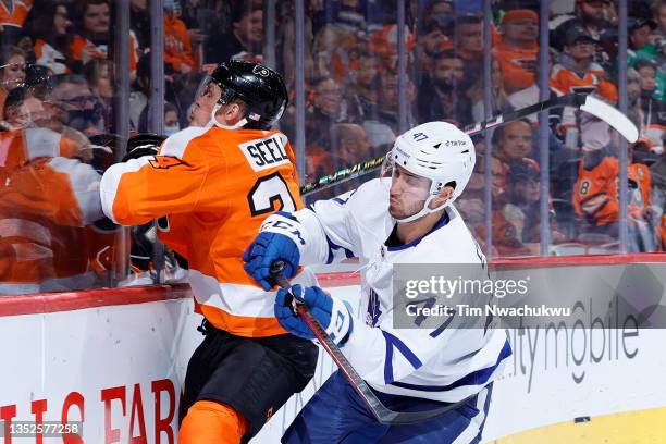 Pierre Engvall of the Toronto Maple Leafs collides with Nick Seeler of the Philadelphia Flyers during the third period at Wells Fargo Center on...