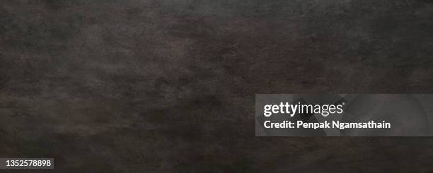 black glossy paper texture abstract background, wallpaper or backdrop arts. empty wrapping paper, poster, shiny paperboard for decorative design element. paper space for copy write grainy gradient smooth surface design for card, cement wall, concrete - stenen muur stockfoto's en -beelden