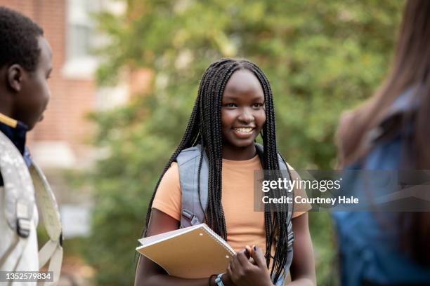 middle school students talking outdoors - junior high student stock pictures, royalty-free photos & images