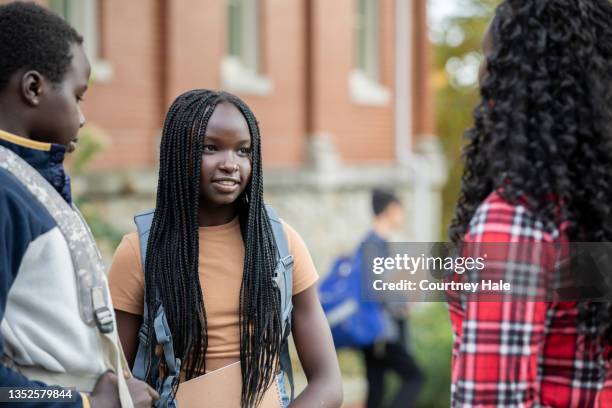 mother dropping her children off at school - braided hairstyles for african american girls stock pictures, royalty-free photos & images