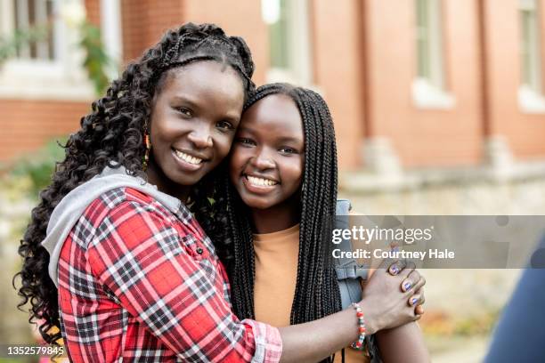 proud mother dropping daughter off at school - braided hairstyles for african american girls stock pictures, royalty-free photos & images