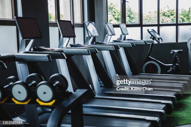 treadmill without people in a gym - sports training facility stock pictures, royalty-free photos & images