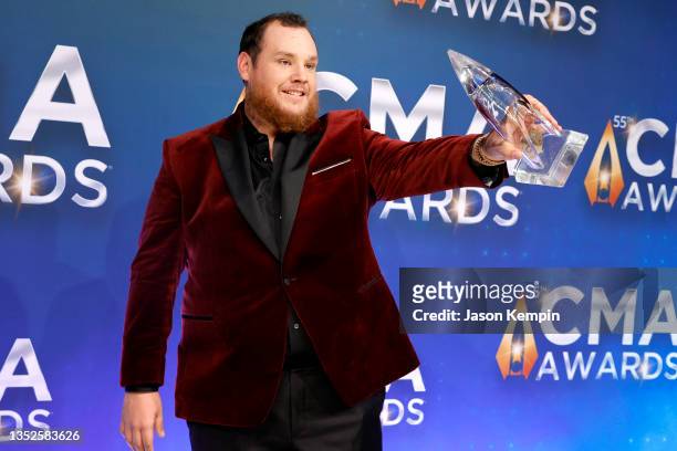Luke Combs poses with his award for the 55th annual Country Music Association awards at the Bridgestone Arena on November 10, 2021 in Nashville,...