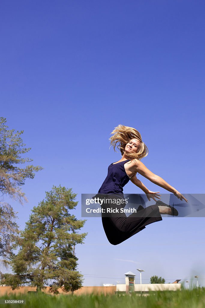 Woman jumping in air