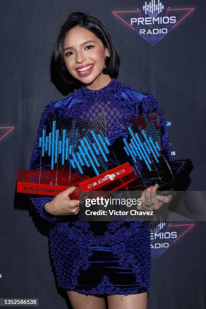 Ángela Aguilar poses backstage with the Female Artist Of The Year Award, Latin Pride Award, and Mariachi Song Of The Year Award during the EstrellaTV...