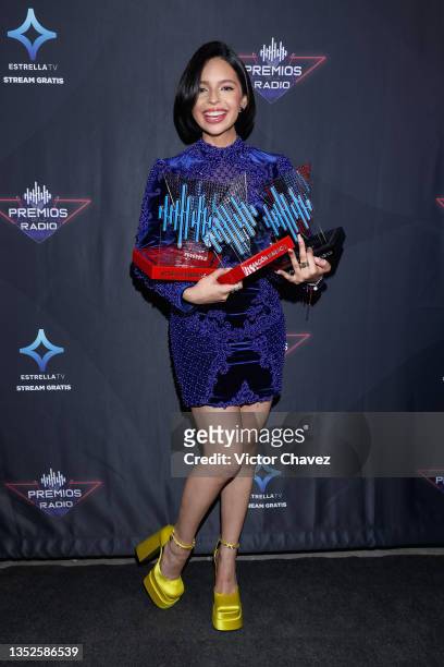 Ángela Aguilar poses backstage with the Female Artist Of The Year Award, Latin Pride Award, and Mariachi Song Of The Year Award during the EstrellaTV...