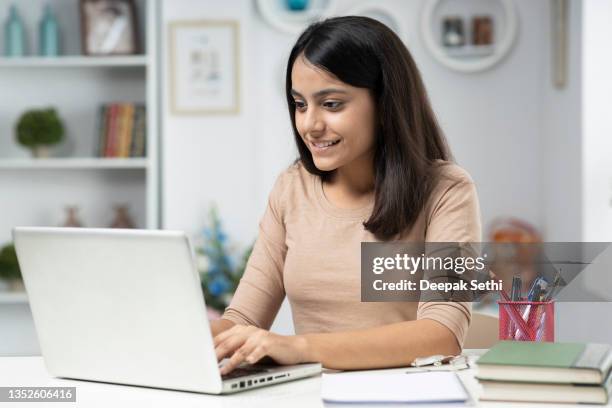 young woman working at home, stock photo - working girl stock pictures, royalty-free photos & images