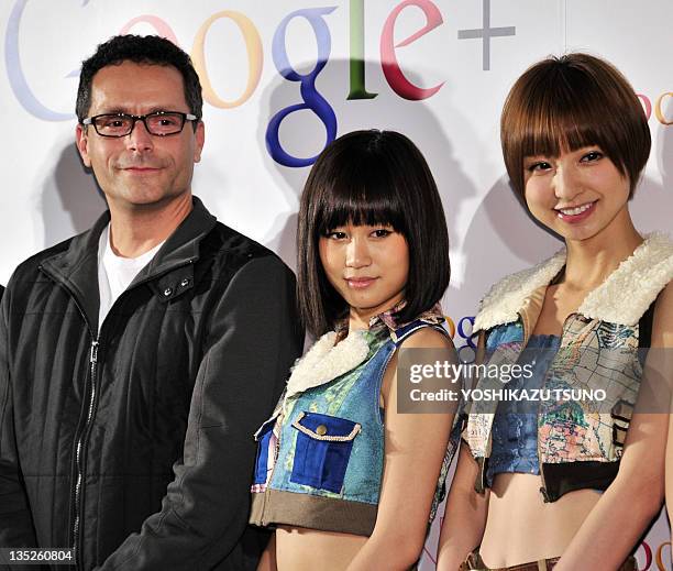 Google vice president Bradley Horowitz smiles with Japanese all-girl pop group AKB48 members Atsuko Maeda and Mariko Shinoda as they announce plans...