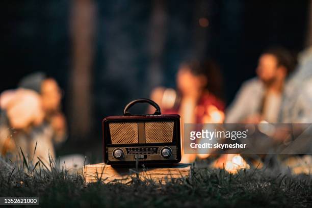 close up of retro radio during camping night. - music speaker stock pictures, royalty-free photos & images