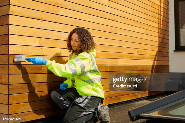 protecting the cedar cladding - siding building feature stock pictures, royalty-free photos & images
