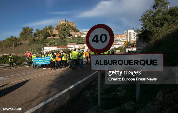 Municipal workers participate with placards in a road blockade called for not receiving their paychecks, on 11 November, 2021 in Alburquerque,...