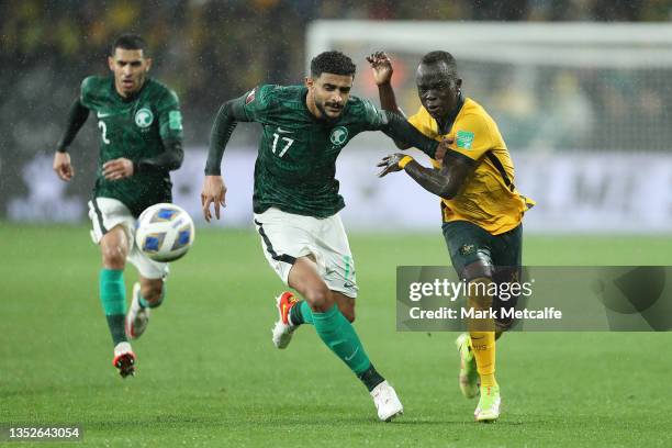 Awer Mabil of Australia takes on Abdulelah Alamri of Saudi Arabia during the FIFA World Cup AFC Asian Qualifier match between the Australia Socceroos...