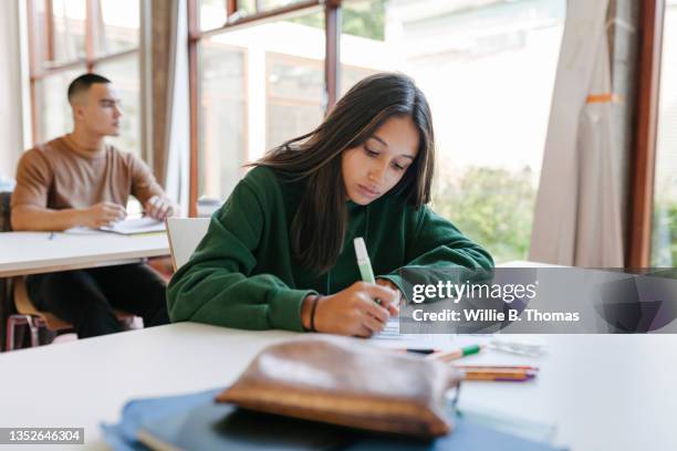 high school student concentrating during test - school exam stockfoto's en -beelden