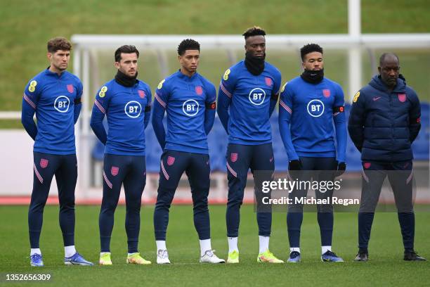 John Stones, Ben Chilwell, Jude Bellingham, Tammy Abraham, Reece James and Chris Powell, Assistant Manager of England observe two minutes of silence...